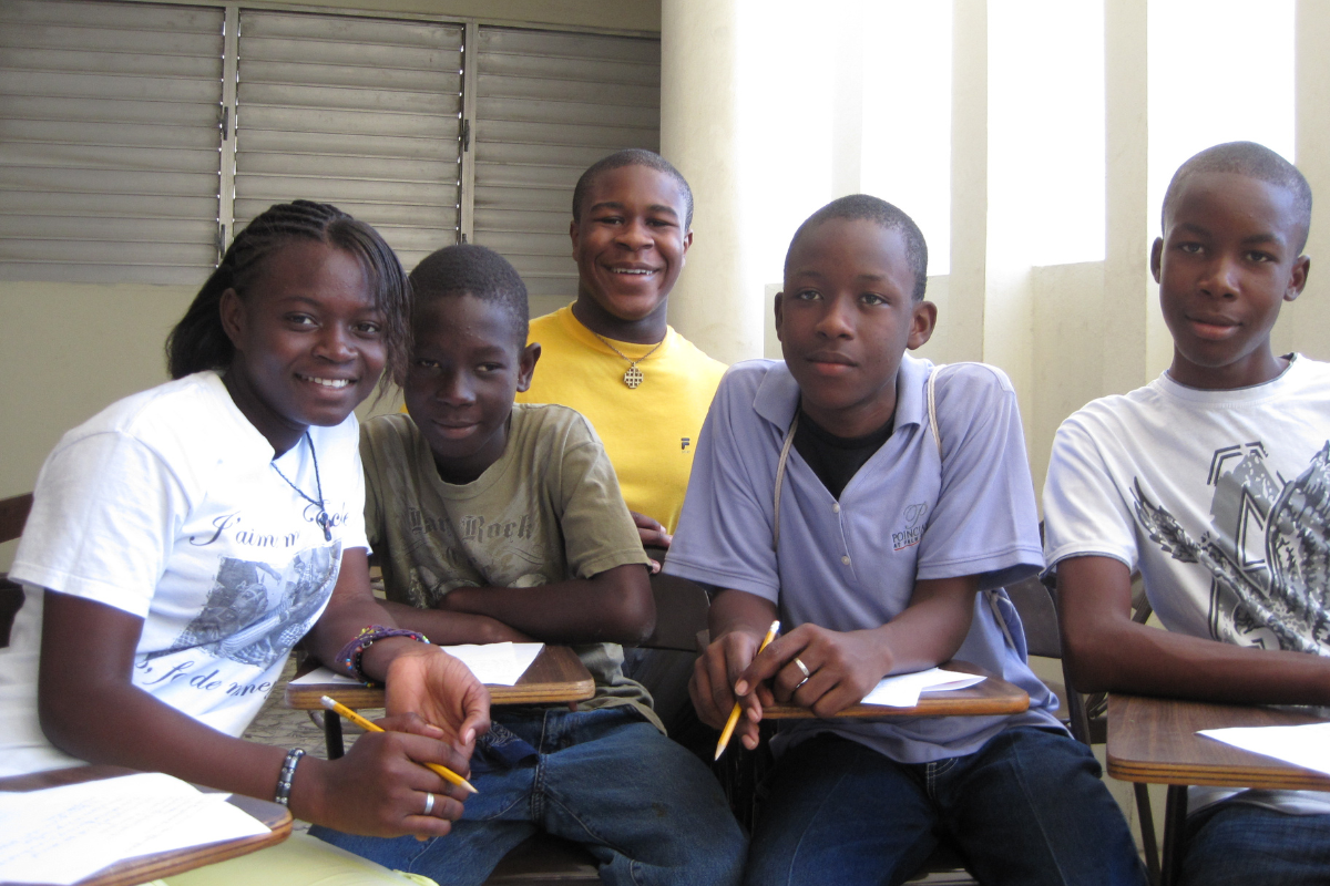 Anebi with children in Haiti